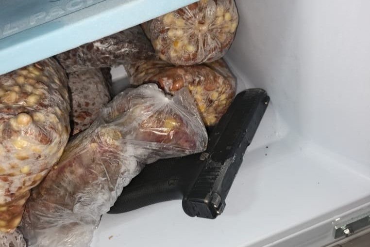 Suspect arrested with firearm hidden among food in refrigerator