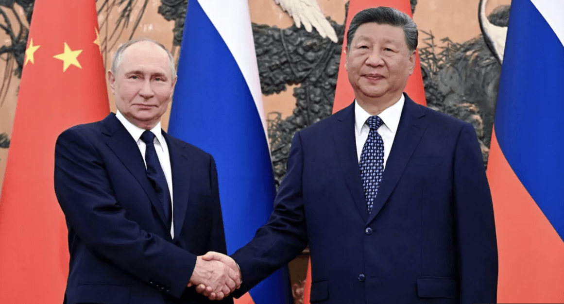 Putin hails ties with China as talks begin