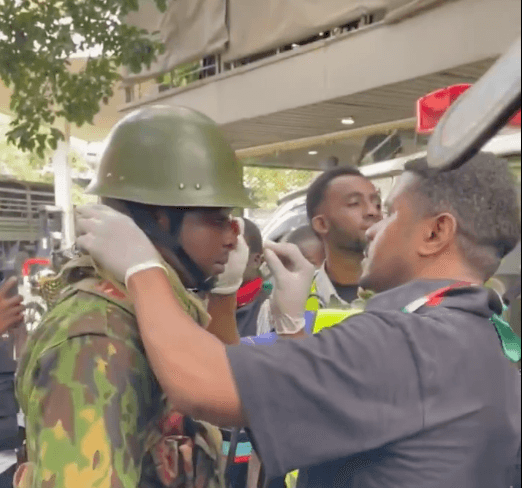 Humanity as Khalid attends to injured cop