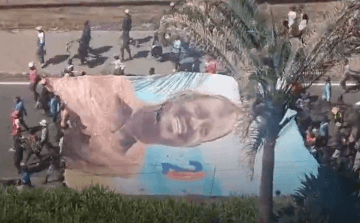 United in grief: Raila’s supporters carry giant banner through CBD